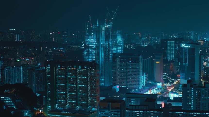 A building is being constructed over time at night