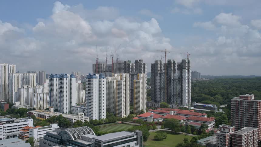 A time lapse during daytime hours show the progress of multiple high rises being built