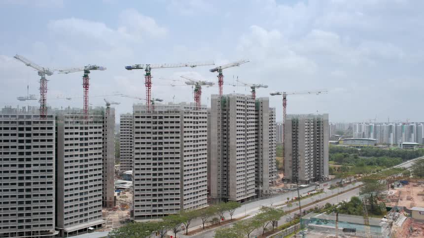 Multiple buildings erect over time to form a city