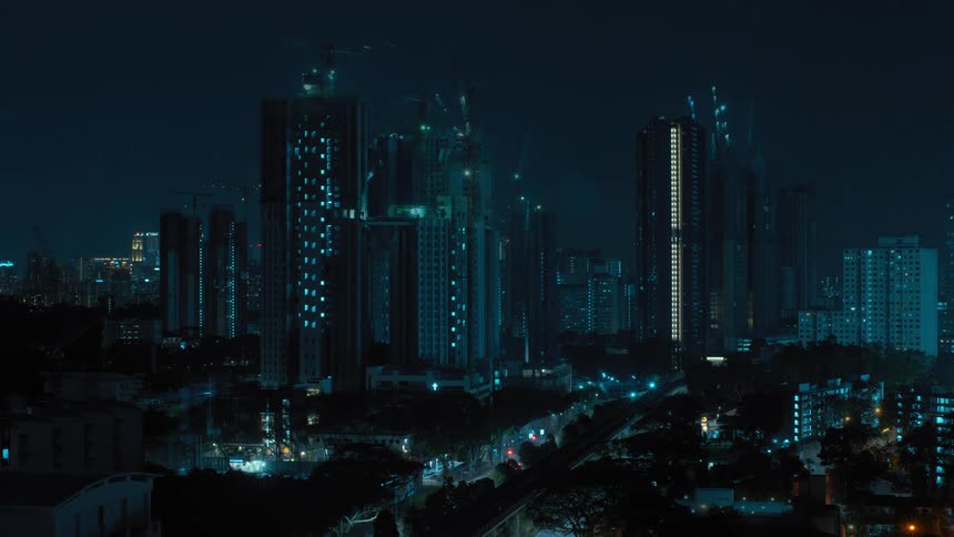 Constructing high rise buildings at night in the city