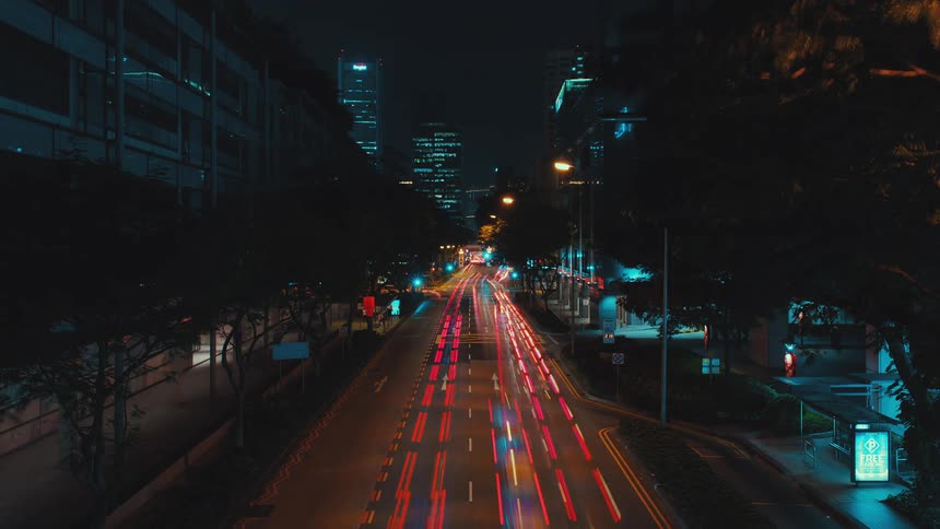 A city with buildings vehicles streets and trees