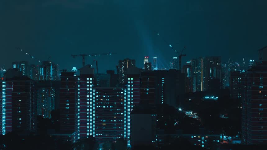 Time lapse of construction cranes on high rise buildings in a city