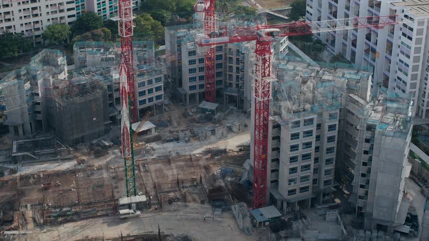 Workers move around building construction site near downtown