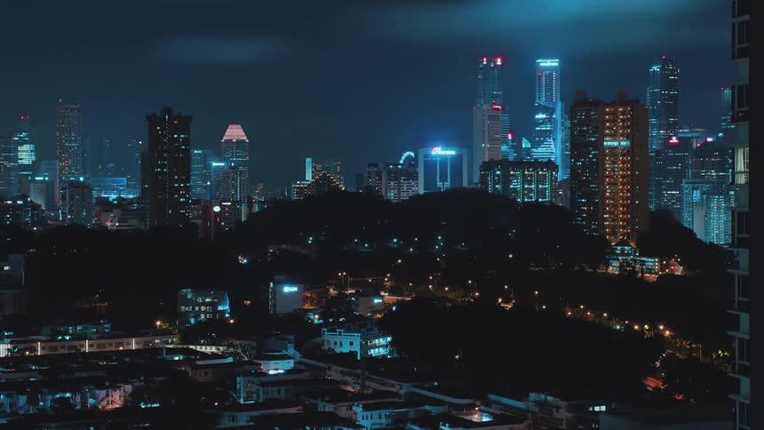 Time lapse of the night lights in the city skyline at night