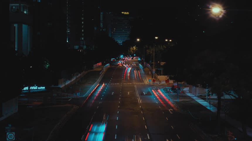 Time lapse of a city road with cars driving