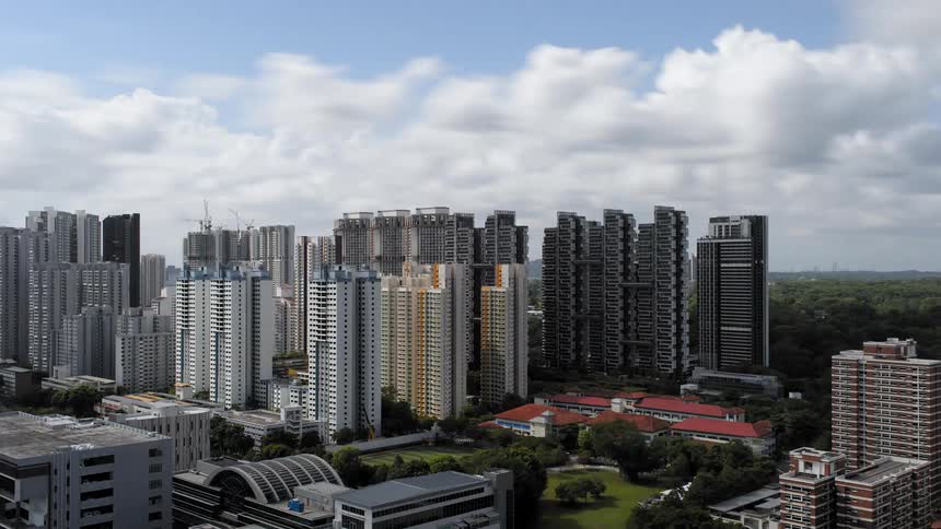 View of tall buildings and condos as clouds speed up and slow down