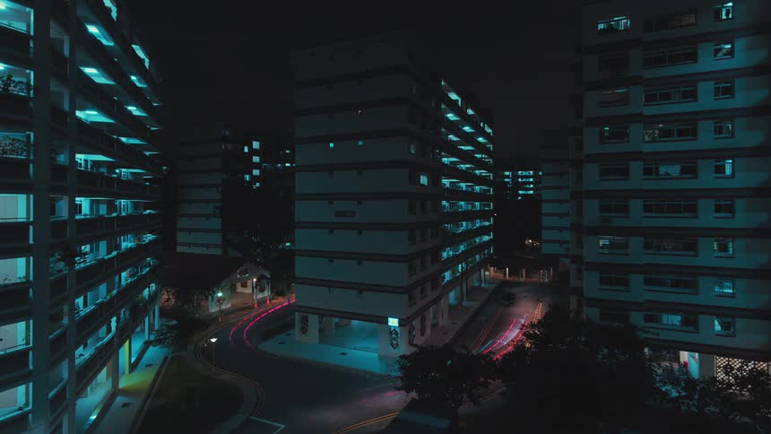 Time lapse of cars driving on a street in a city at night