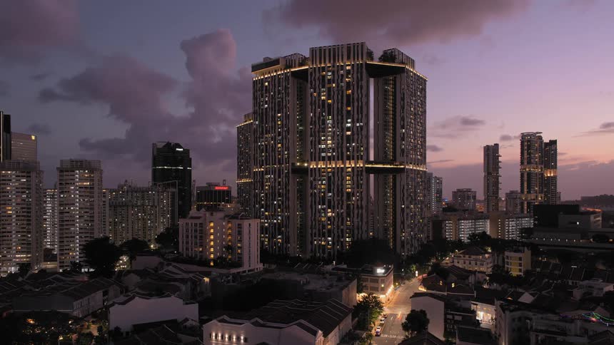 Time slows down on a  city with buildings vehicle and trees with the sky and clouds