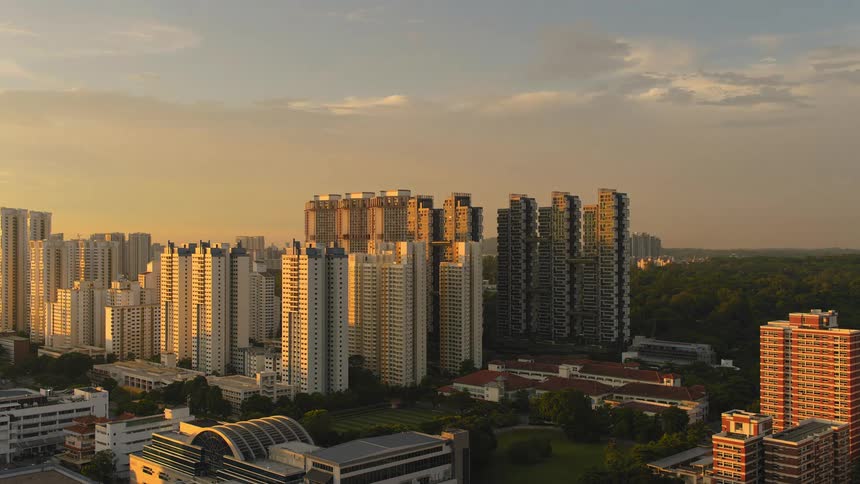 Time lapse of clouds passing over skyscrapers in a city at different times of day