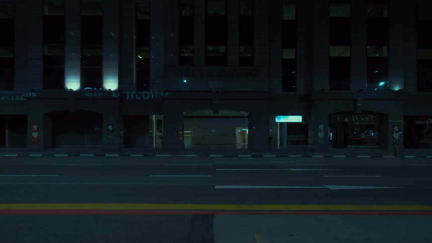 Time lapse of vehicles driving on the city street leaving a trace of light behind at night