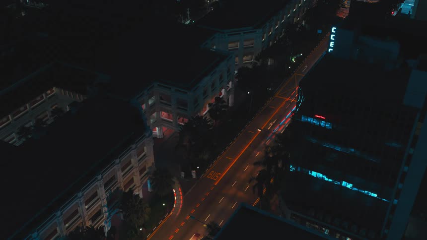 A time lapse of cars driving at night in a city
