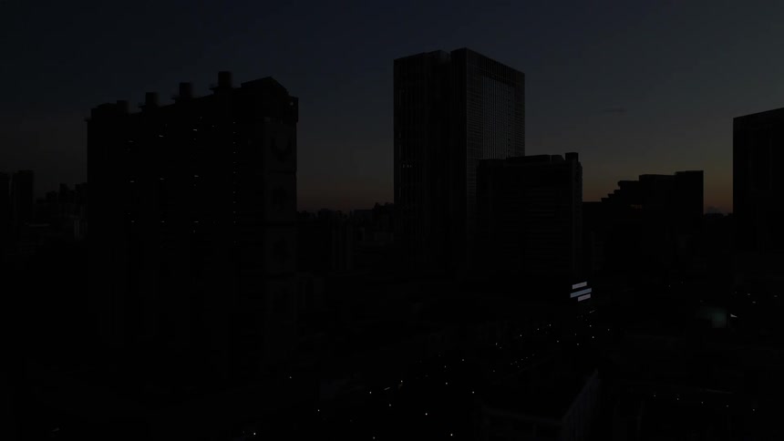 Multiple tall buildings are shown at various times of day during a time lapse