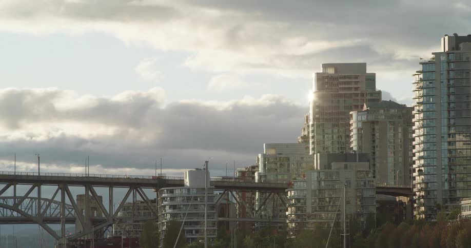 Time lapse of cars driving across a bridge in a city