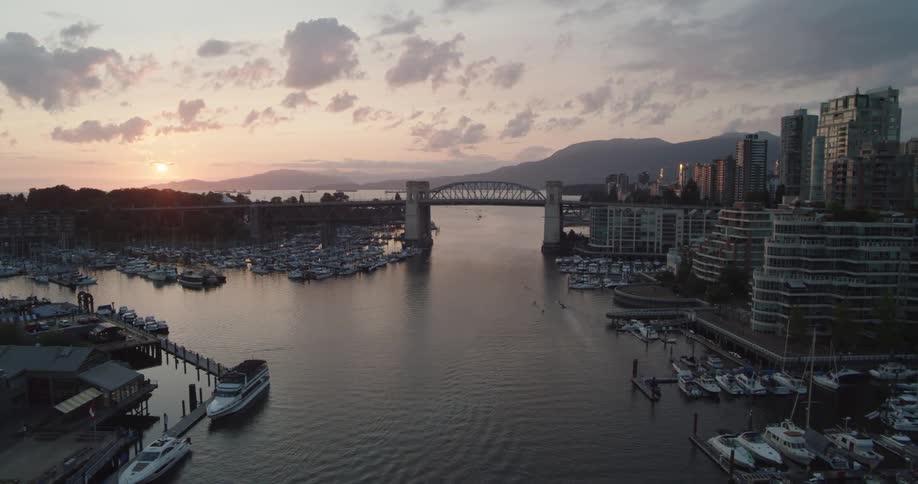 Vancouver city sunset featuring Burrard Bridge and False Creek