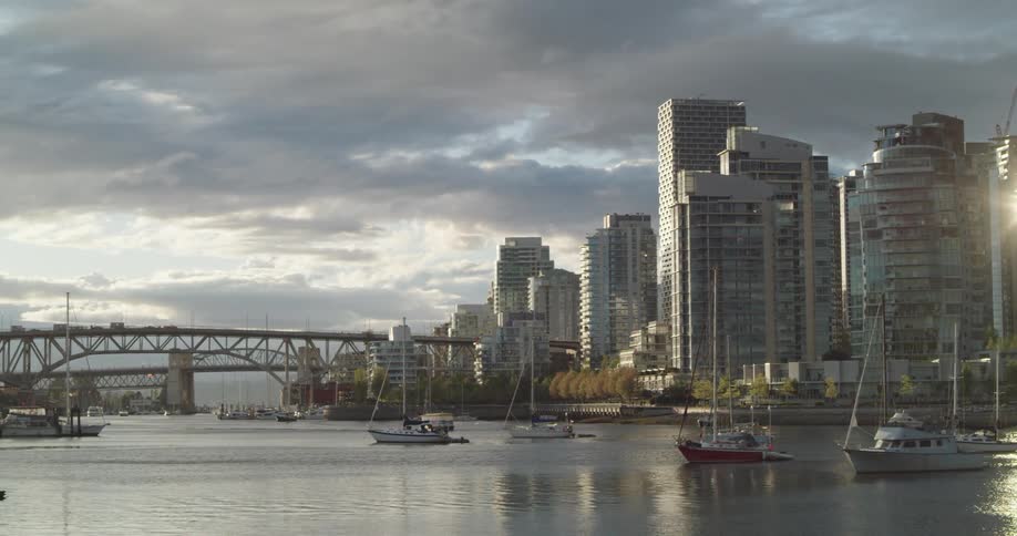 A bridge located next to downtown Vancouver spans a large waterway