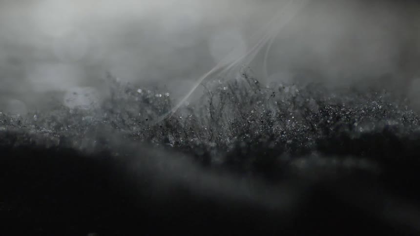Smoke rises from a black fabric