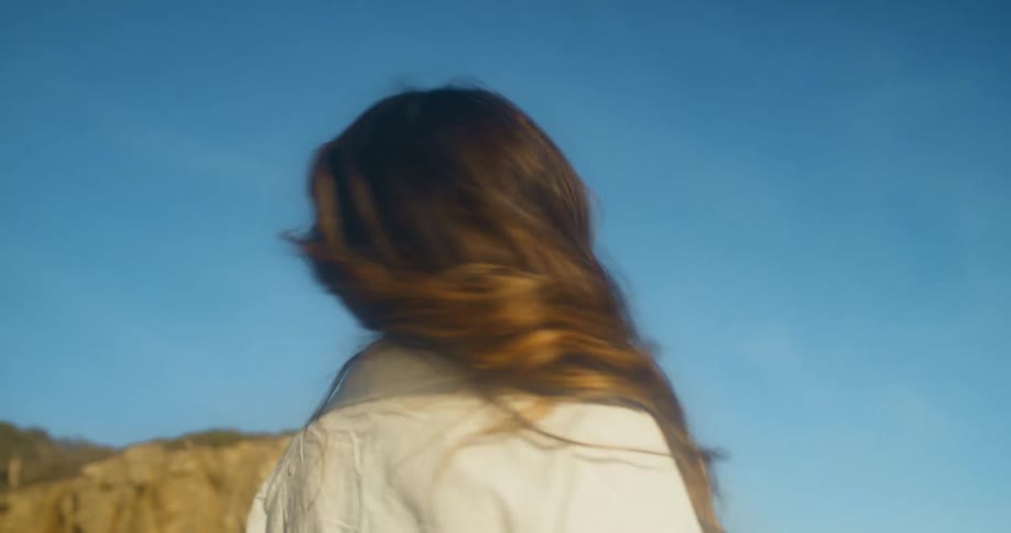 A woman dancing around outdoors