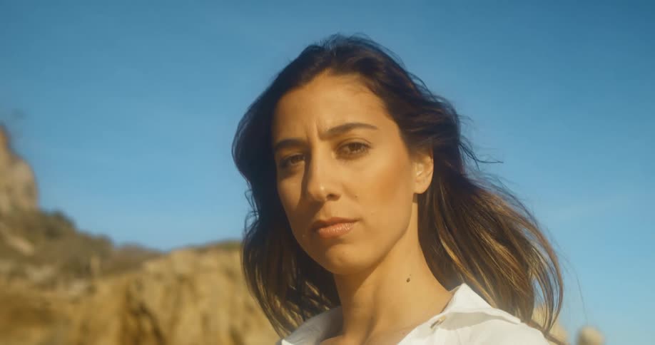 A portrait of a woman standing outdoors