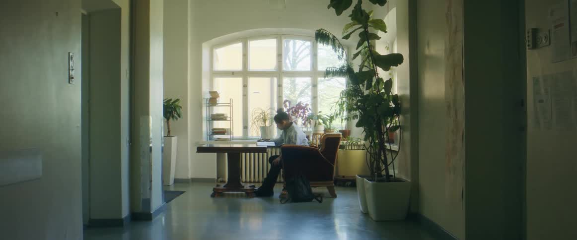 A woman writing at a desk