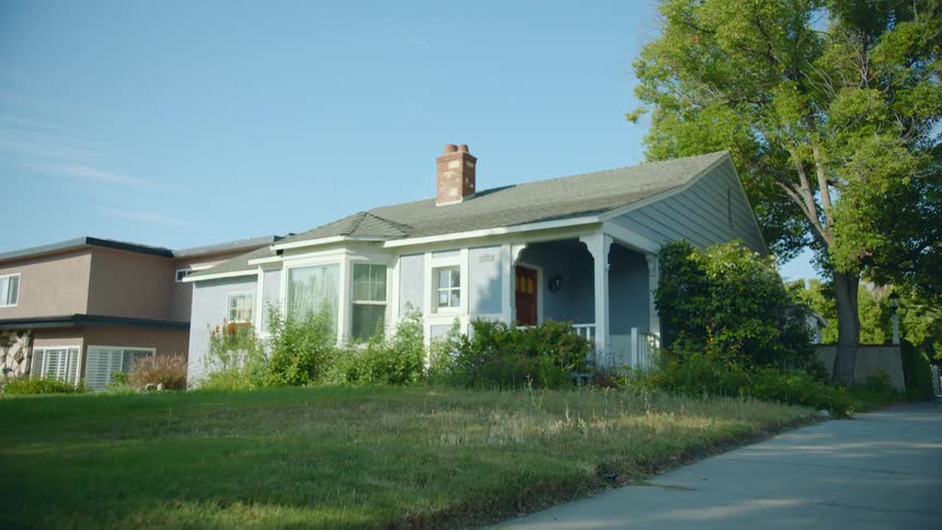 A view of a house in a neighborhood