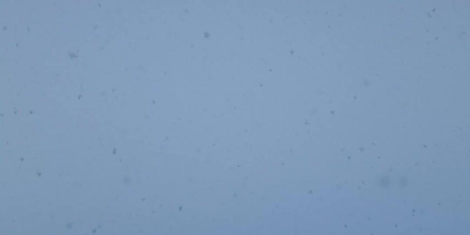 Large snowflakes fall from the sky