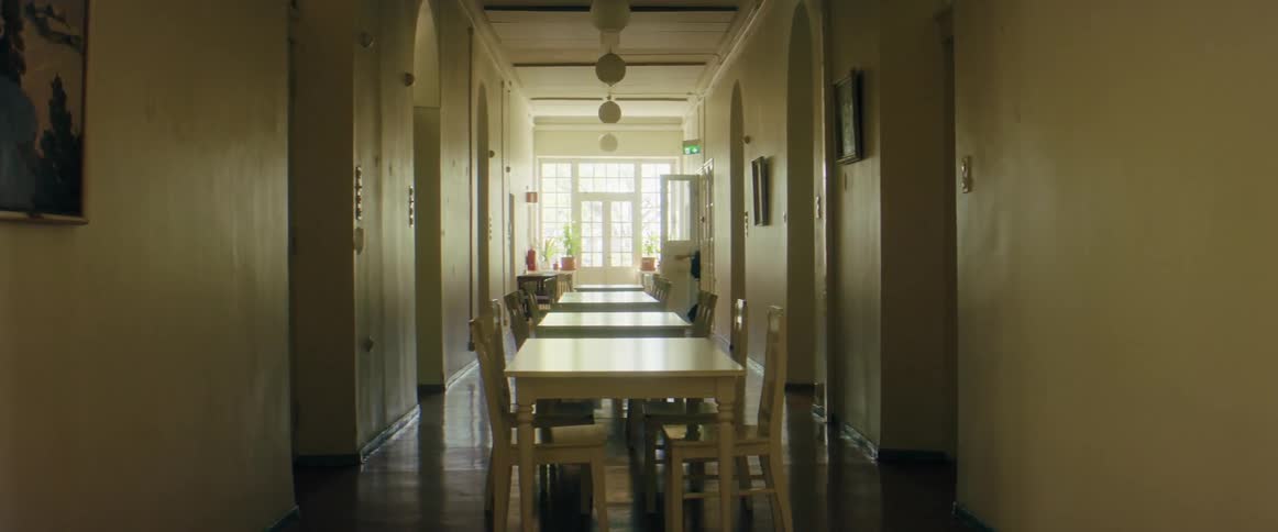 A woman walking out of a room
