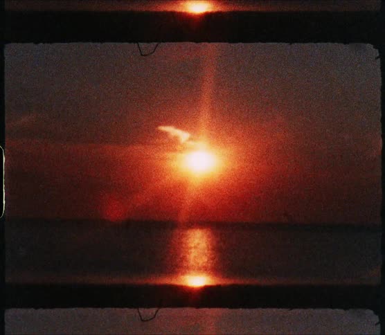 A view of the sun setting at the ocean