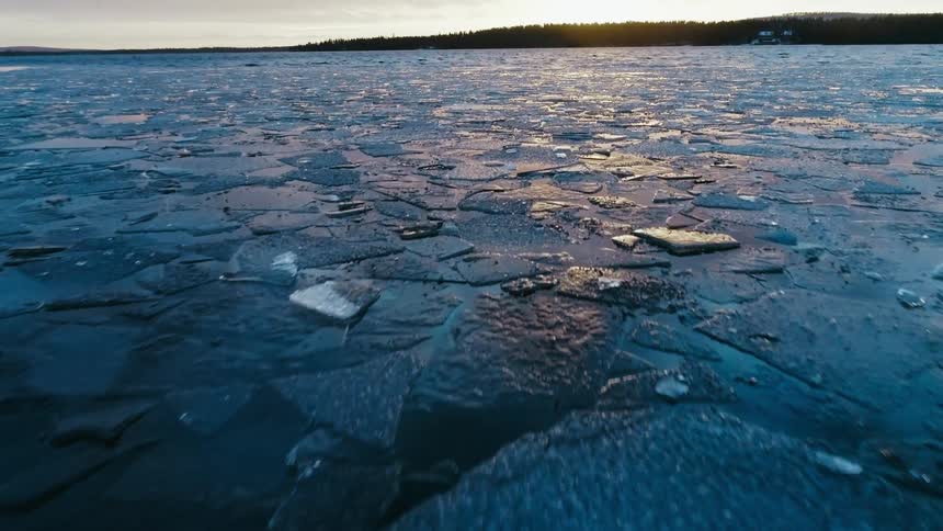 Water is frozen on the ocean at dusk