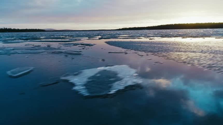 Chunks of ice float on the ocean water