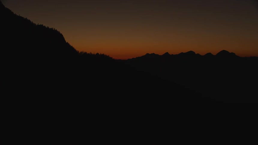 A view of a silhouette of mountains in the distance