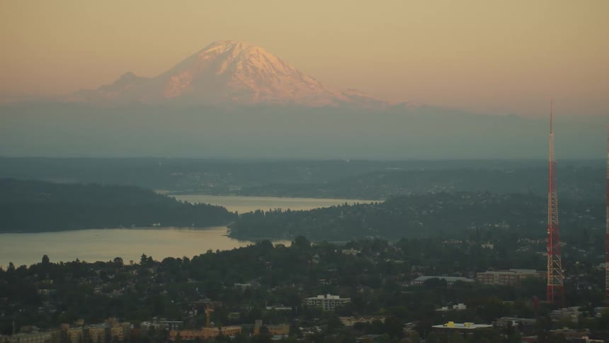 Aerial view of a city is displayed at dusk in spring