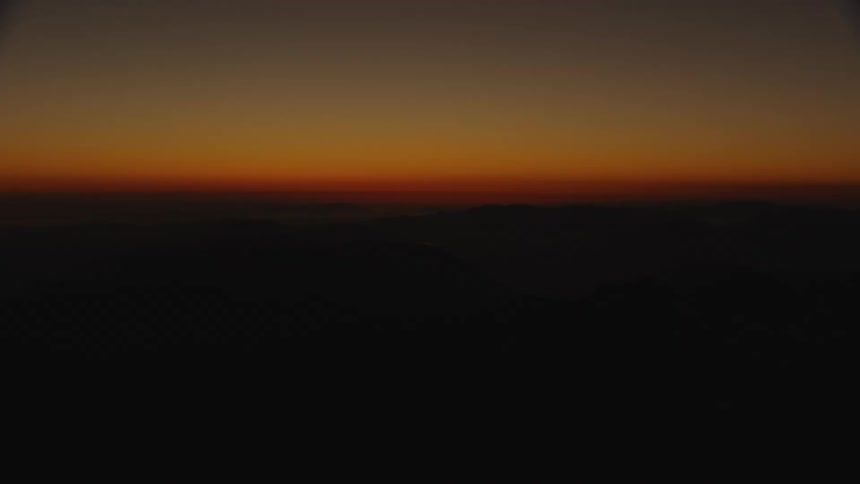 The sun is setting in the horizon