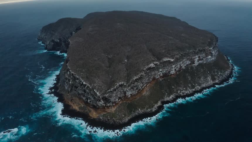 Large rock sits in the ocean