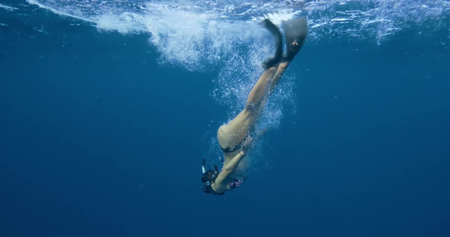 A woman swimming under water