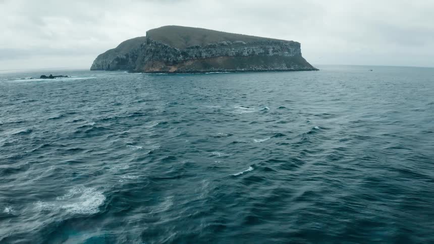 Ocean water is moving towards the coast of an island