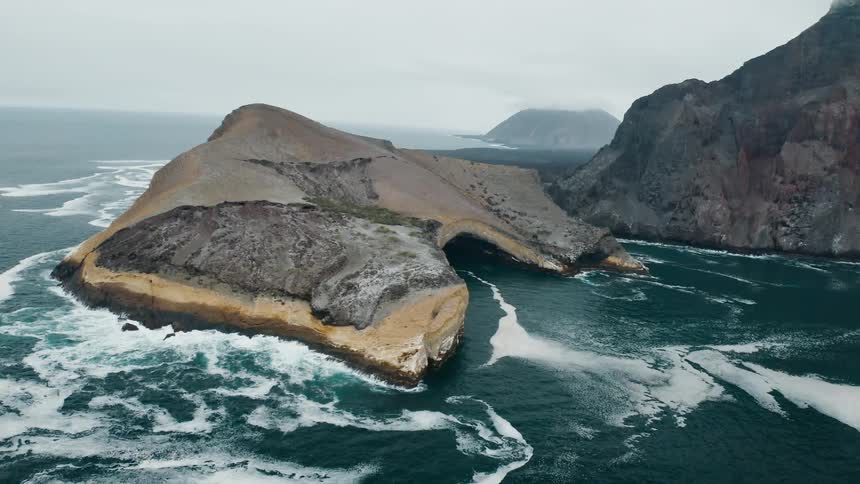 An aerial view of rocks in the ocean