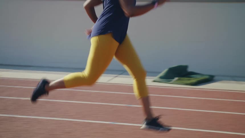 A woman running on a track