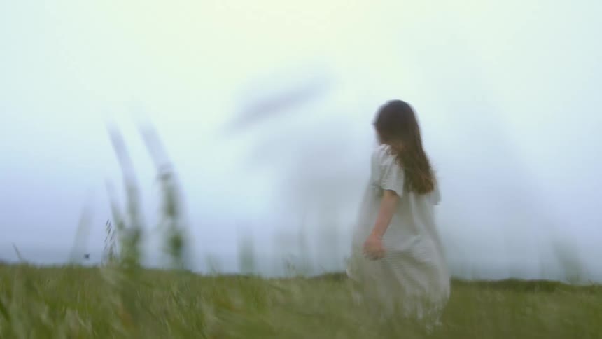 A woman running in a field