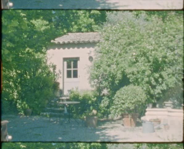 A vintage film of the outside of a house
