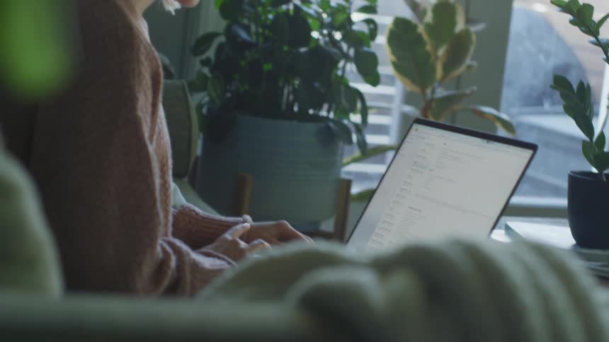 Woman typing on laptop
