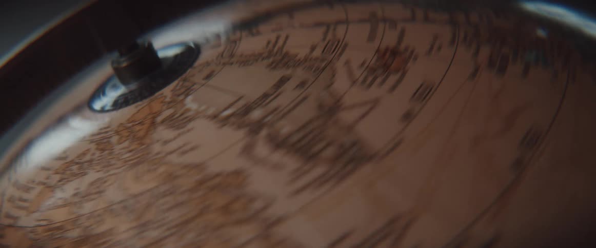 A spinning globe slows and comes to a stop
