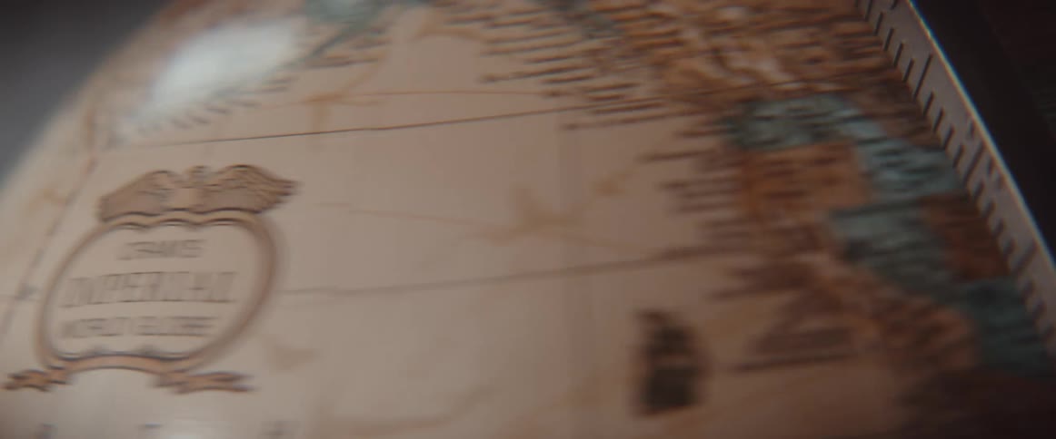 Old style world globe spinning and coming to a stop