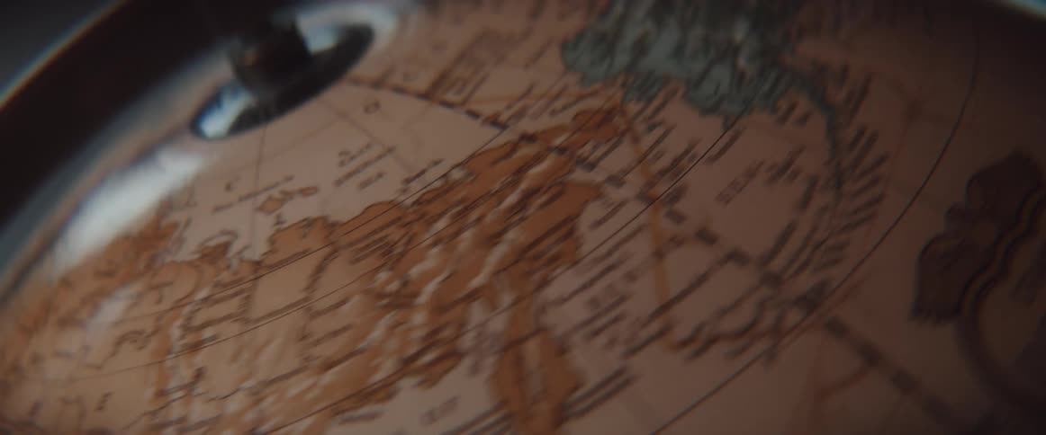 Close up of a spinning earth globe slowly coming to a stop