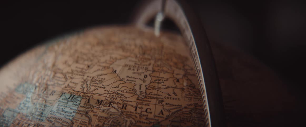 Round globe with a measuring device attached to it spins in a circle