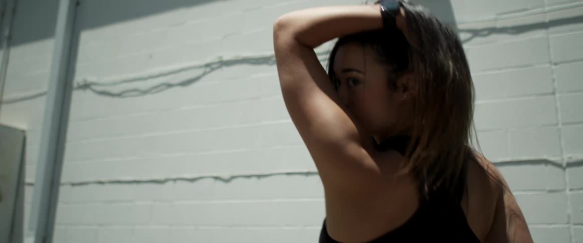 A woman dancing outdoors