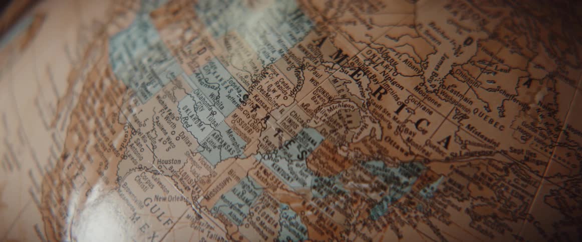 Old style world globe slowly spinning