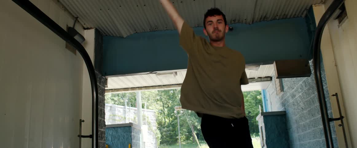 Male dancer inside alleyway
