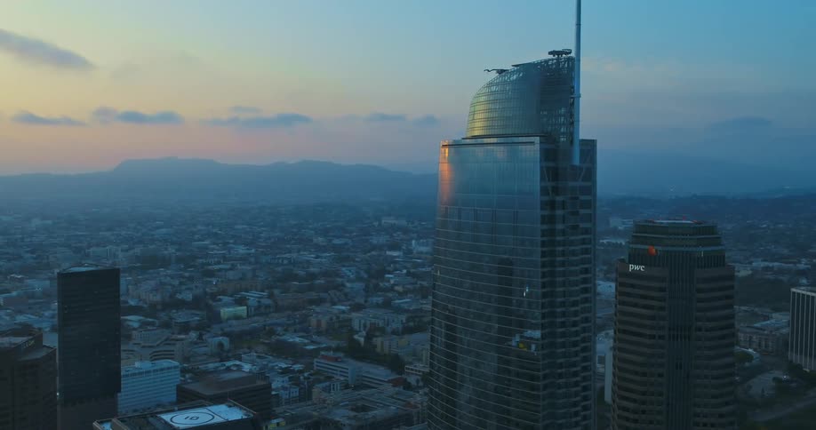 An aerial view of a high rise office building in a city