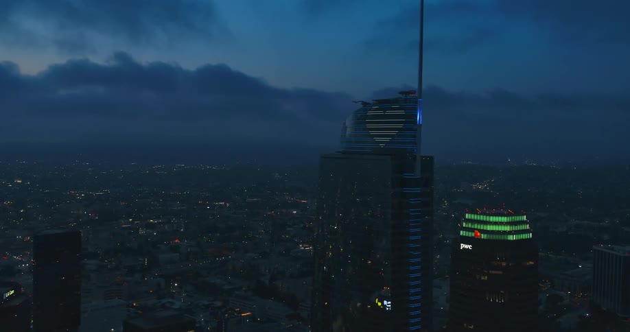 A heart shaped light is on the top of the tower
