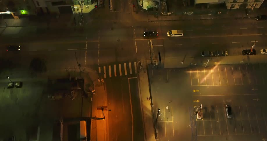 Aerial view of traffic on a small city streets at night